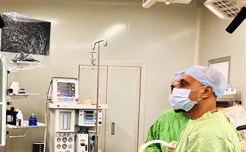 Dr Prasad Bhukebag in the operating theatre during laparoscopic surgery